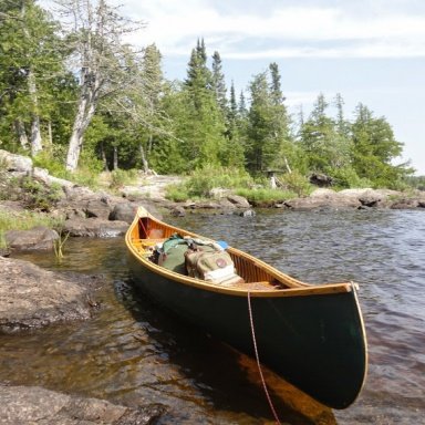 Blue Canoe 1920's Chestnut Wood and Canvas Canoe